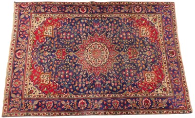 Lot 693 - A Persian rug, blue ground, with central...