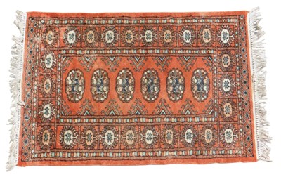 Lot 695 - A Bokhara rug, pale red ground, with six...