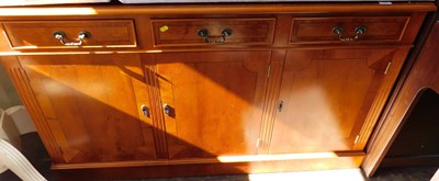 Lot 1137 - A reproduction yew sideboard, with gallery...