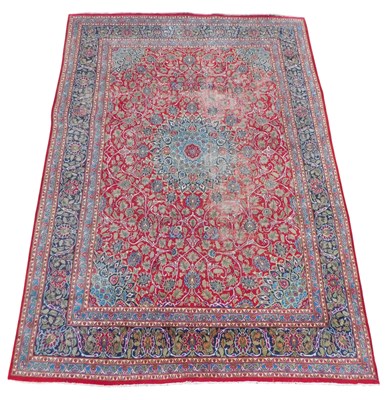 Lot 698 - A Persian rug, red ground with central floral...