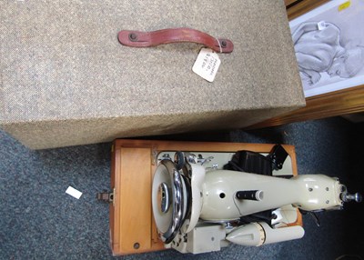 Lot 2211 - A vintage Novam cased sewing machine.