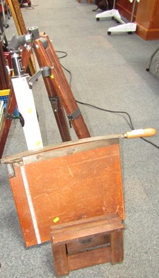 Lot 2218 - A tabletop mounted guillotine, telescope,...