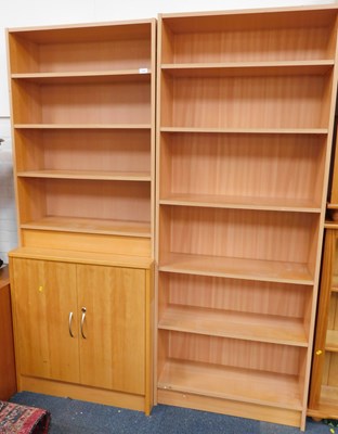 Lot 1183 - A bookcase with a cupboard below, with four...