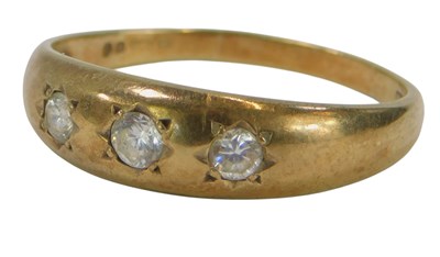 Lot 85a - A 9ct gold white paste three stone ring, size...