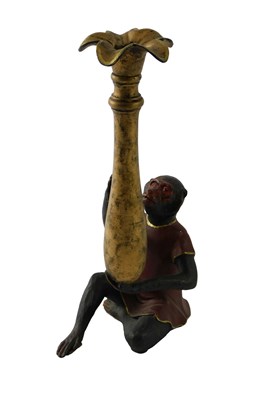 Lot 129 - A cold painted cast metal candlestick,...
