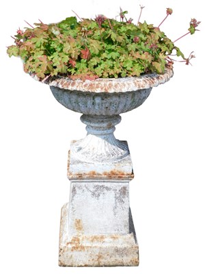 Lot 285 - A cast iron urn, on square supporting pillar,...