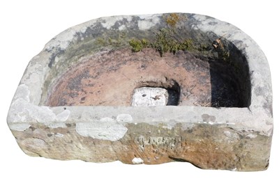 Lot 287 - A half moon shaped sandstone trough or planter,...