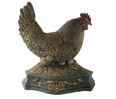 Lot 165 - A cast iron and painted door stop, modelled in...