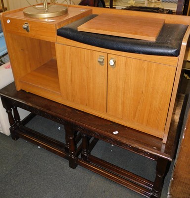 Lot 1047 - A telephone seat/table with drawers and a door...
