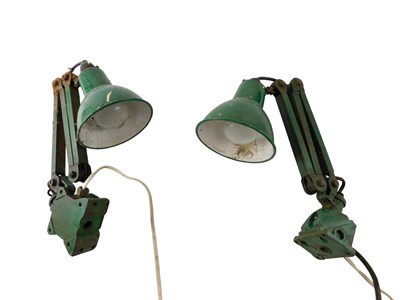 Lot 229 - Two green enamel workshop lamps, with shades....
