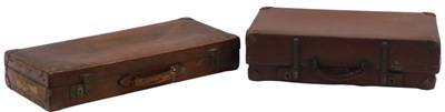 Lot 239 - A brown simulated and leather suitcase, 73cm...