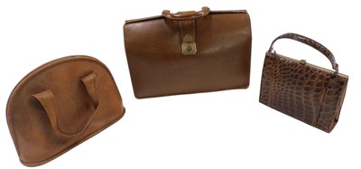 Lot 240 - A brown leather briefcase, a brown leather bag,...