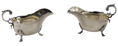 Lot 334 - A pair of George V silver sauce boats, each...