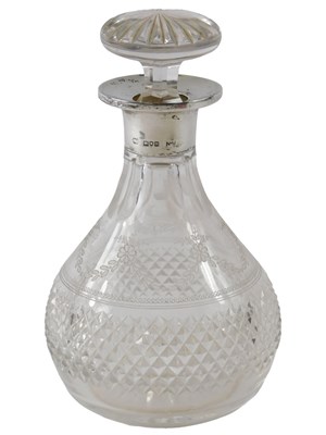 Lot 337 - A George V cut and engraved glass bottle and...