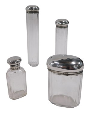 Lot 357 - Four cut glass dressing table jars, each with...