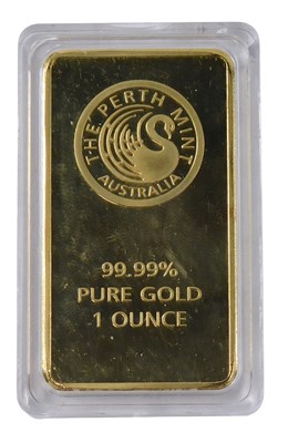 Lot 506 - A gold plated Ingot stamped 99.99% pure gold...