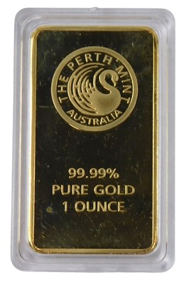 Lot 505 - A gold plated Ingot stamped 99.99% pure gold...