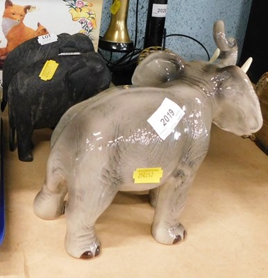 Lot 2019 - A Melba ware elephant, together with two dark...