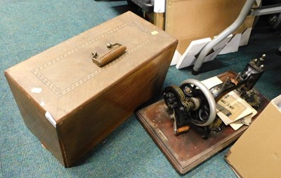 Lot 2110 - An early 20thC sewing machine, parquetry cased,...