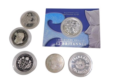 Lot 408 - A collection of silver coins, a 2003 silver...