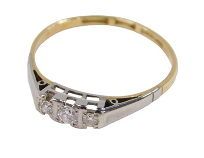 Lot 60 - A diamond three stone ring, claw set, in white...
