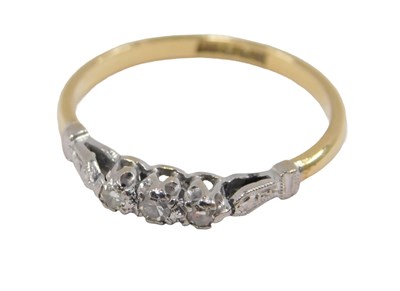 Lot 47 - A diamond three stone ring, in a high claw...