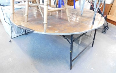 Lot 1515 - A folding event table, the circular wooden top,...