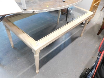 Lot 1516 - A limed coffee table, inset with a glass panel,...