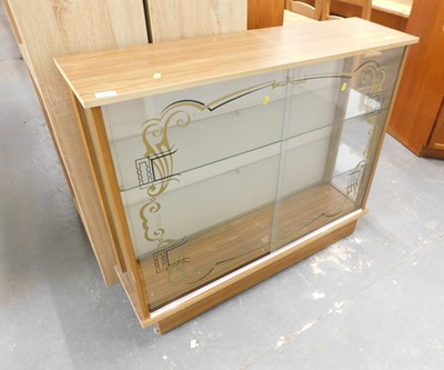 Lot 1547 - A mid century display cabinet, with two glazed...