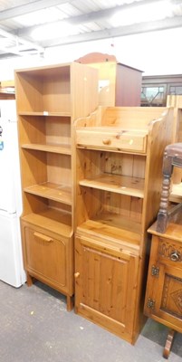 Lot 1563 - A pine shelving unit, with a raised back and...