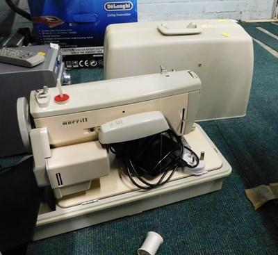 Lot 2197 - A cased 20thC Merriot sewing machine.