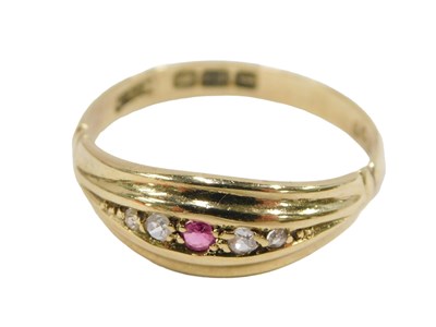 Lot 308 - An 18ct gold ruby and diamond ring, set with a...