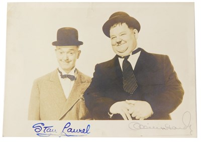 Lot 569 - A Laurel and Hardy postcard, with facsimile...