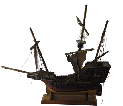 Lot 585 - A painted model of a three masted galleon, on...