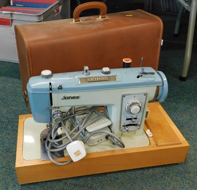 Lot 2209 - A cased Jones sewing machine.  WARNING! This...