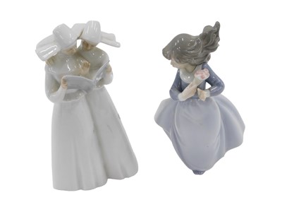 Lot 604 - A Nao figure of a young girl with flowers, and...