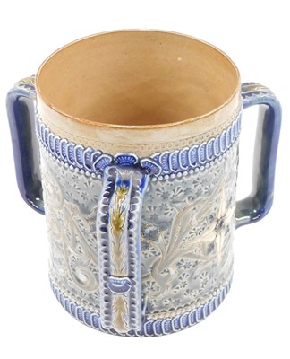 Lot 615 - A Royal Doulton stoneware Tyg, with incised...