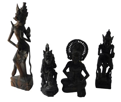 Lot 718 - A Group of Thai and Balinese hardwood carvings,...