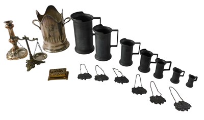 Lot 720 - A group of metalware, to include a graduated...