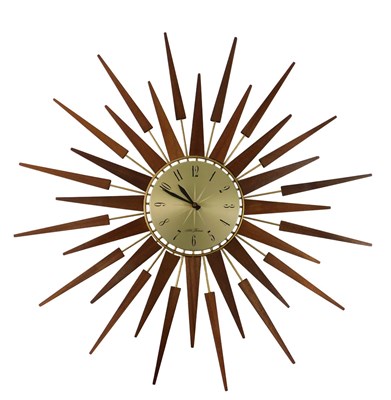 Lot 732 - A mid century Seth Thomas teak starburst clock,...