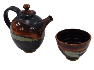 Lot 692 - A Studio pottery teapot, black glaze, with...