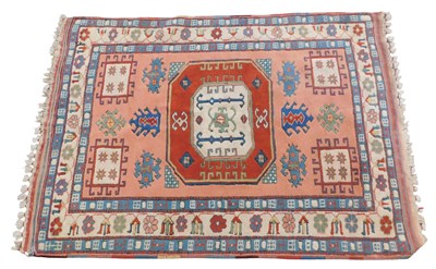 Lot 855 - A Turkish carpet, with a design of latch hook...