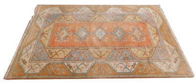 Lot 856 - A Turkish rug, with a geometric design, on a...