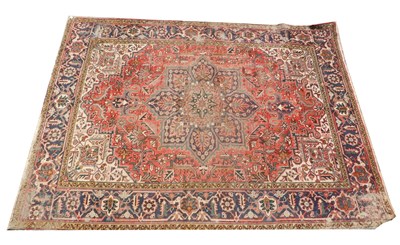 Lot 858 - A Heriz Persian carpet, with a geometric...