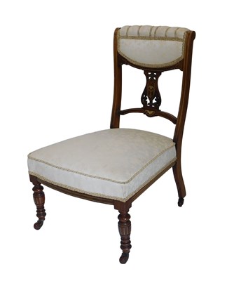 Lot 869 - An Edwardian rosewood and marquetry nursing...
