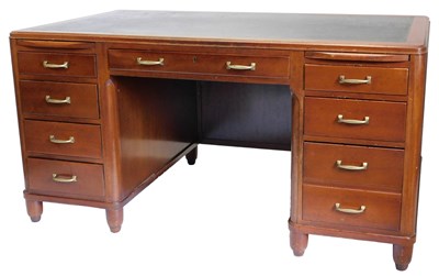 Lot 871 - A mid-century mahogany kneehole desk, the top...