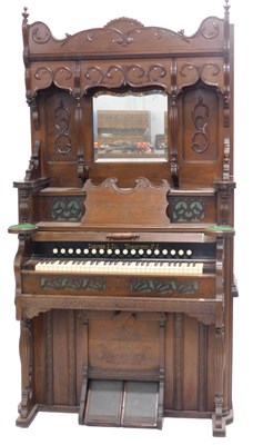 Lot 1248 - A late 19thC American walnut harmonium, the...