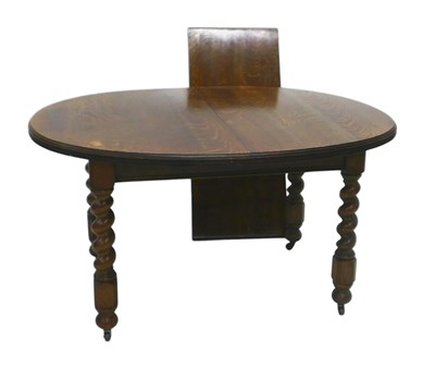Lot 836 - An early 20thC oak extending dining table, the...