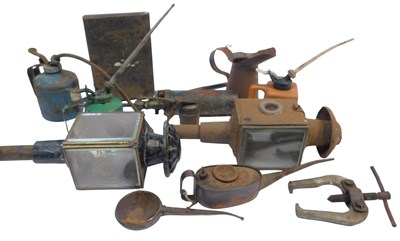 Lot 25 - A group of oil cans, together with a Boots...