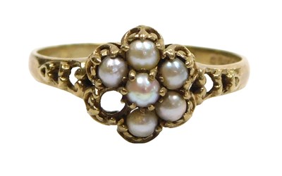 Lot 121 - A 9ct gold and seed pearl flower head ring,...